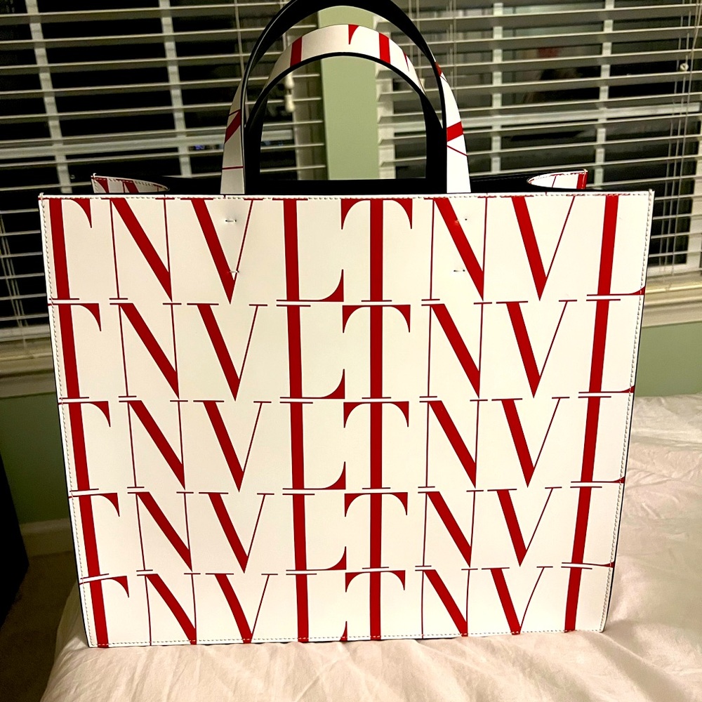White with logo print . Brand new . Never used .